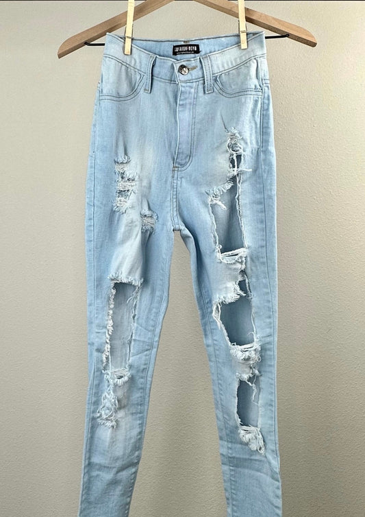 Light Wash Ripped Jeans By Fashion Nova